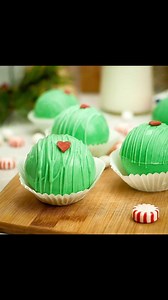 Grinch Hot Cocoa Bombs—Whimsical and mischievous, these green spheres are made with white chocolate and have a red candy heart for decoration. {Blog link in bio or search on dizzybusyandhungry.com} . . . #hotcocoa #foodelicious #foodiepic #dizzybusyhungry #hotcocoabombs #foodphotos #dizzybusyandhungry #foodphotograph #cocoabombs #forkyeah #ontheblognow #grinch #foodpicoftheday #instayummy #grinchdesserts #recipeshare #deliciousfoods #grinchchristmas #foodbloggers #foodislove #hotchocolatebombs #