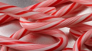 clip-1591282-closeup-candy-canes-moving-across-screen-clear