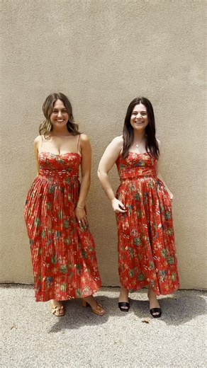 Cam and MJ model one of our favorite Ulla Johnson dresses ❤️ The sweetheart neckline and midi silhouette looks flattering on all sizes and the bright colors are perfect for summer. Shop the Jessie dress in store and online today! | SKIRT