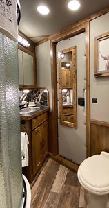 Don't miss out on this beauty!😍 This 2023 Elite 4 horse is available now at Korral Supply. 11' 9" short wall with a Classic Collection living quarters that combines beautiful alder cabinetry with a modern touch of black detail! | Signature Quarters, Custom Living Quarters