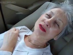 Beautiful granny masturbates in her car