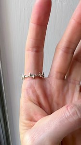 This is the new ✨Coffin Cut Diamond Barbed Wire Ring! This ring features a coffin cut salt and pepper diamond surrounded by 18 round cut black diamonds on a 14k white gold barbed wire band. #coffinring #saltandpepperdiamondring #blackdiamondring #uniqueengagementring #blackdiamondengagementring | Leviticus Jewelry