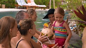 clip-1006815505-guests-relaxing-resort-swimming-pool-bar