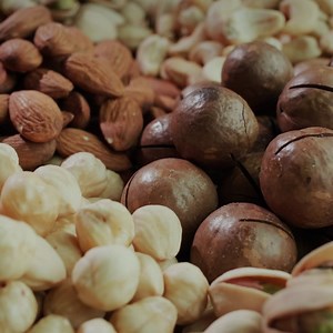 Handfuls of ready-to-eat nuts of different varieties Premium Stock Video Footage