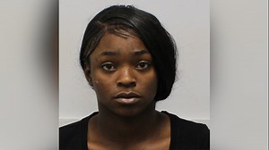 Woman accused of shooting man after he intervened in argument at Motel 6