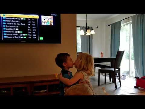 Adorable toddlers hug and kiss goodbye