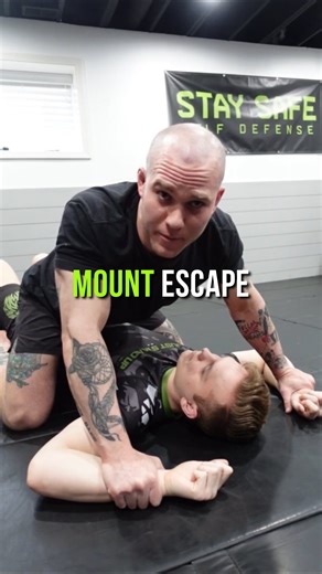 Disrupt their base! Whenever someone is holding you down in mount, especially a bigger person, focus on disrupting their base. In other words, force them to post their hands on the ground. This gives you the opportunity to start working your hips out from under them, and ultimately allowing you to get back to your feet. Go train. Stay safe 🤙🏻 #selfdefense #selfdefensetraining #womenssafety #womensselfdefense #mountescape #staysafe | Stay Safe Martial Arts