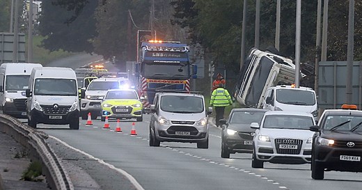 Overturned lorry on A55 causes delays - updates