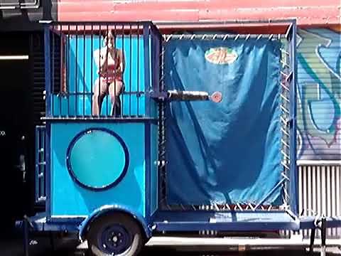 Girl in Jeans Takes a Quick Dip in the Dunk Tank
