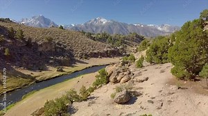 Aerial Reveal of Hot Creek Geologic Site River Stream Valley Mountain Range - Inyo National Forest - Mammoth Lakes, California 10 Stock Video