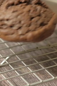 Chocolate cookies with a melted Andes mint on top are the perfect mint chocolate cookie! RECIPE: https://ohsweetbasil.com/andes-mint-chocolate-cookies-recipe/ #cookies #andesmints #chocolate #mintchocolate #chocolatecookies | Sweet Basil