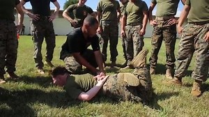 Training to React III MEF Marines with the Camp Guard detachment on Camp Hansen, Okinawa, Japan conduct non-lethal weapons training and quick reaction drills to better serve and protect their fellow troops. (U.S. Marine Corps video by Lance Cpl. Christian J. Lopez) | III MEF Marines