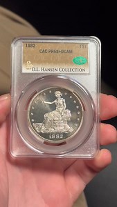 Today's pick from the grading room! #dlhansen This 1882 Trade Dollar is graded CAC PR68 DCAM • • • #cac #caccoins #cacgrading #coins #toner #copper #silver #silvercoin #proofcoin #coinerrors #coincollecting #coincollector #coincollection #coincollectors #constitutionalsilver #coinoftheweek #rarecoins #money #preciousmetals #coinsforsale #coinsale #numismatics #numismatic #history #collection | CAC Grading
