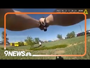 Body camera footage: Officer shoots, kills unarmed man at parking lot near DIA