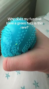Help #squishy #fuzzball | green fuzzball with one blue fuzz