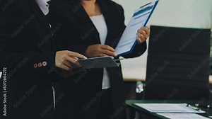 Teamwork with businessman analyzing cost graphs on table at conference room.