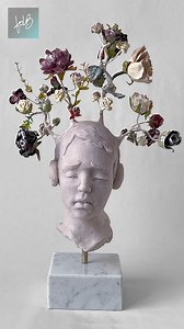 Thoughts blossom from the boy's headphones. He listens contemplatively whether it be to music or to his own thoughts. As he explores the inner workings of his mind, his thoughts and feelings take root and bloom into delicate flowers. Witness the true power of sound as Francesca Dalla Benetta Art brings her sculpture “Listen to Me” to life. This mixed media sculpture made predominantly from resin and marble depicts a young boy wearing headphones as he embarks on a journey of self-discovery. #beau