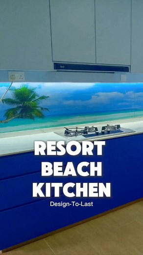 RESORT BEACH KITCHEN: Imagine stepping into a kitchen where every meal preparation feels like a serene escape. The design seamlessly blends modern functionality with the tranquil charm of a tropical resort. The kitchen sink, perfectly positioned, offers a breathtaking view through a large window that stretches across the cooking area. Beyond the glass, a pristine, sun-kissed beach unfolds, with gentle waves lapping the shore and the vibrant colors of the sea and sky creating a peaceful backdrop.