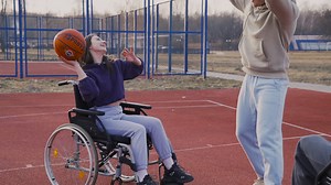 Young Disabled Woman Bouncing The Ball And Throwing It To Her Friend And The Basketball Hoop | Free Stock Video Footage