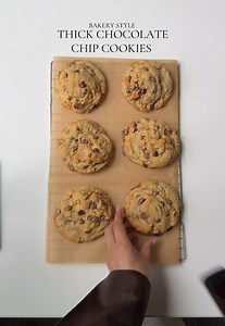 Bakery-style thick chocolate chip cookies. Ingredients 227g cold European unsalted butter, cubed 180g brown sugar 110g granulated sugar 1 large egg 1 large egg yolk 1 tbsp vanilla bean paste 405g all-purpose flour 1 tsp espresso powder 1 tsp baking powder ½ tsp baking soda ½ tsp salt 1 tsp cornstarch 1 1/2 cups semi sweet chocolate chips 1/2 cup milk chocolate chip Method Preheat your oven to 350°F (175°C). Line two baking trays with parchment paper. In a large mixing bowl, combine the cold cube