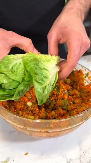 Kısır (Bulgur salad) by dr.vegan Recipe!!! To a bowl add -1 1/2 cups of fine bulgur -1 1/2 cups hot water cover and let it sit for 20 mins. In the meantime, saute -1 onion In a generous amount of olive oil. Then add -1 tbsp tomato paste -1 tbsp red pepper paste Stir and then add it to the bowl of bulgur with: -2 tbsp of pomegranate syrup -1 tsp of black pepper -1 tsp of red pepper flakes -1 tsp of sumac -salt to taste Combine and then mix with the veggies: -1 bell pepper, diced -3 spring onion, 