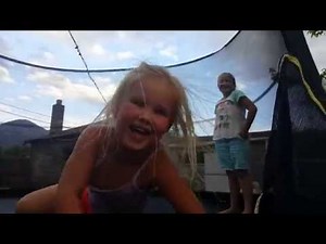Sisters just having fun doing gymnastics on the trampoline and farting