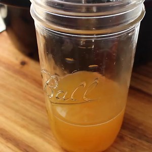 Apple cider and cinnamon sticks are simmered in the slow cooker and then added to Everclear or Vodka in this recipe for Crock-Pot Apple Pie Moonshine. Delicious flavored adult beverage that is perfect for fall and winter sipping! 🍏🍎🍏🍎 [Weight Watchers Friendly Low Calorie, Low Carb, Low Cholesterol, Low Fat, Low Sodium, Low Sugar, Vegan & Vegetarian] Get the full recipe & instructions here>> https://crockpotladies.com/crock-pot-apple-pie-moonshine/ | Crock-Pot Ladies