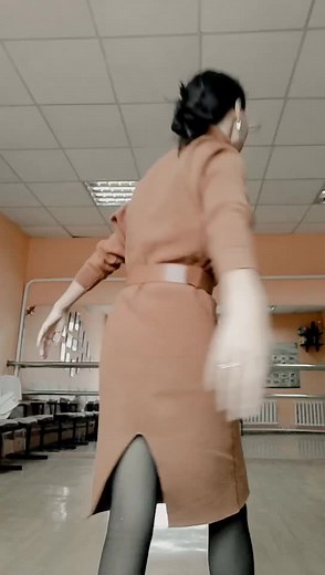 Dynamic Dance Moves in Stylish Rust-Colored Dress