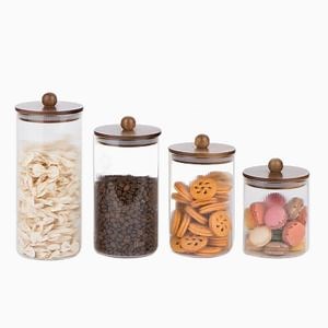 [Hot Item] Borosilicate Round Glass Container Jar with Acacia Wood Lid Balls on Lid Embossed Vertical Line