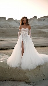 This ultra-feminine #MillaNova wedding dress features a flattering coset bodice bathed in delicate floral lace appliques detailing with a daring thigh-high slit and detachable sleeves. Discover the style: https://bit.ly/3WBsphX #租婚紗 | DBR Weddings | Facebook