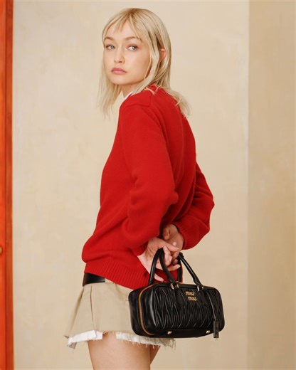 The Arcadie bag fuses modern lightness with traditions of leather craft. Featuring Gigi Hadid. Video by Steven Meisel. Creative direction by Edward Quarmby. Styled by Lotta Volkova. Discover more at https://tinyurl.com/yap9dtsv #MiuMiu #MiuArcadie | Miu Miu