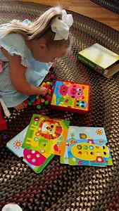OT toy of the week: ✨ Fine Motor Skills – Pinching, grasping, and manipulating those buttons build up the small muscles in the hands and fingers. 🧠 Bilateral Coordination – One hand holds, the other places buttons. 👀 Visual-Motor Integration – Eyes guide the hands to align and push buttons through holes. 🧘‍♀️ Patience & Focus – It takes concentration and persistence to button successfully. | Juliet’s Journey