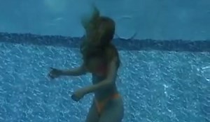 sexy bikini girl drowning underwater