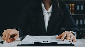 Download Female lawyer is stressed about losing a lawsuit. Woman stressed and worried because overworked. for free