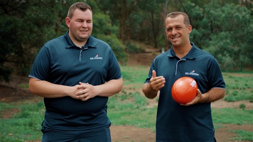 When you’re about to kick a drop punt… How do you hold the footy? This past Monday, Coaches Mick and Tala took us through a skill activity designed to improve your ball drop called ‘Kneeling & Bouncing’. Today, Mick & Tala give some pointers about how this activity can help find your natural hand position when holding the footy. Do you spread your fingers widely or keep them close together? Do you hold one hand higher than the other? Do you place your hands on the higher or lower part of the foo