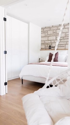 Step into this magnificent master suite, where tranquility and serenity take center stage. With a perfect blend of natural materials, this space breathes peace of mind, creating an oasis of relaxation and wellness. Stone Pictured: Indiana Limestone veneer Design by Germain Boivin Design Photo by Sweet Home Marilou Vanity & taps by Kohler Masonry by Polycor Furniture by La Galerie du Meuble Shower glass by Espace Brio Wall tile by La Tuilerie Floor tile by Arta Ceramics | Polycor