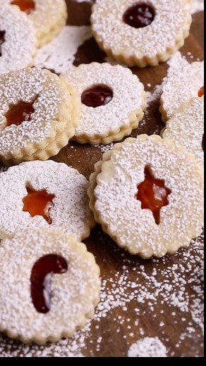 These nutty, buttery, jam-filled cookies are a Martha Classic and a holiday must-try! Inspired by the Linzertorte, an Austrian tart dating back to 1653, these festive cookies are a beautiful adornment to any table. Toasted almonds supply the perfect nutty flavor, while lemon zest and almond extract add a sweet brightness to the dough that bakes to a buttery finish. A jammy center of fruit preserves and dusting of confectioners’ sugar completes this classic cookie. Link in bio! . . . . . . . #hol