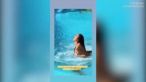 Lucciana Beynon's bikini falls off as she jumps into a pool