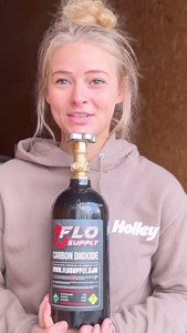 Our girl @Britney Friesen showing off our Flo Supply CO2 bottle and bottle bracket 👀💨 Get everything you see here and more at nitrousoutlet.com or call us at 254-848-4300 📲 | Nitrous Outlet
