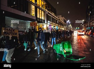 Protesters march through the streets while holding placards during the demonstration. Over 80 people peacefully marched from Cal Anderson Park to the Space Needle and back to Capitol Hill to demand justice for Nichols. The protesters marched through Capitol Hill, downtown, and South Lake Union while chanting the name of Tyre Nichols, who was killed by Memphis police earlier this month. Five Black police officers, shown in the Friday video, chased and pummeled Nichols and left him on the pavement