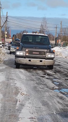 Exploring a Black GMC Truck in Winter Settings