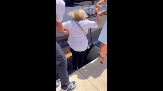 Elderly woman forgets to step over the gap
