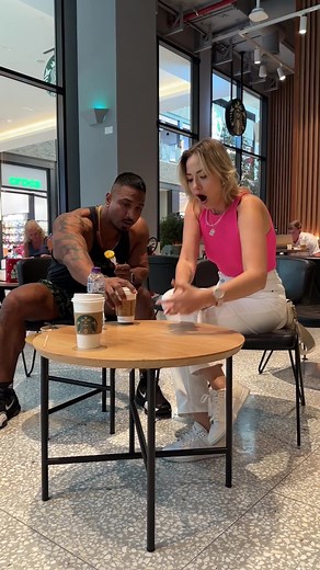 Modern Café Conversation: Muscular Man and Woman