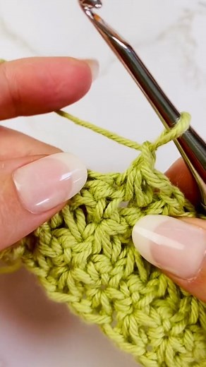 Have you tried the Trinity Stitch? Find the tutorial here --> https://www.nickishomemadecrafts.com/trinity-crochet-stitch-tutorial/ #crochet #learntocrochet #diycrafts #yarn | Crochet Patterns & Tutorials by Nicki's Homemade Crafts