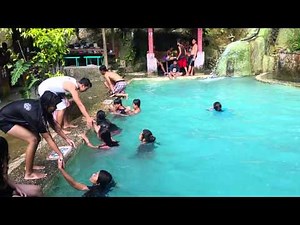 Cheerleaders in swimming pool.