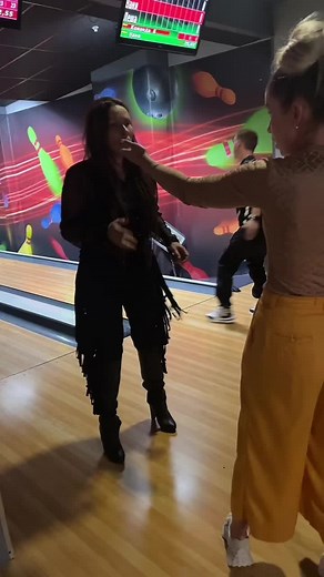Bowling Alley Fun: Playful Women Having a Great Time