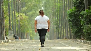 Back View of Overweight Woman Walking at Park Stock Footage - Video of people, road: 124574854