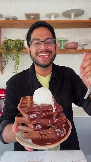 Was this the breakfast of my dreams? Hell Yes! Totallyyy! This recipe cannot be missed guys. It uses only a handful of ingredients and gives you a plate full of wholesome joy! I bet it’ll leave you asking for more! Try it! Ingredients: 1 cup flour 2 tbsp cocoa powder 1 tsp baking powder 1/2 tsp baking soda 1/4 tsp cinnamon 1/2 cup sugar 1 cup milk 2 tbsp butter #bakeWithshivesh #quickrecipes #reelitfeelit #chocolatewaffles #dessert #baking #waffles #trending #reels #explore #recipereel #kitchen 