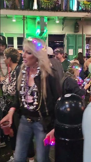beautiful Asian flashes at new orleans mardi gras 2023