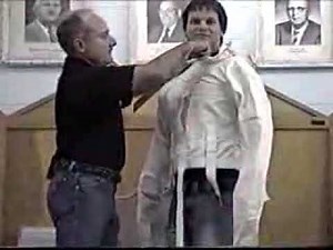 escape artist demonstrate a full body straitjacket escape